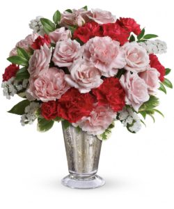 Send someone special a sparkling token of your affection with this gorgeous pink and red bouquet. Romantic as can be, the mix of roses and carnations is beautifully arranged in a chic mercury glass vase. It's an instant classic!