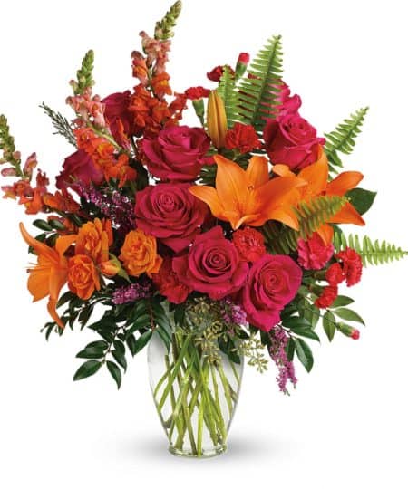 Bright orange, hot pink, and greenery make for a brilliant pop and burst of color to brighten anyone's day. 