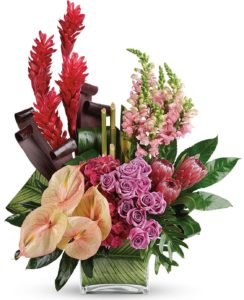 From delicate lavender roses to dramatic red ginger, waxy pink anthuriums to shiny philodendron leaves, this Tahitian-inspired bouquet is a tropical fantasy of blooms to brighten any occasion!