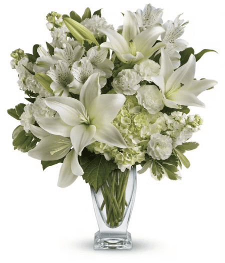Who's the fairest of them all? This snow-white bouquet. A stunning statement of your purest love, this mix of hydrangea and lilies in a Couture vase will take their heart away.